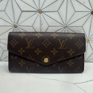 Louis Vuitton Brown Monogram with fuchsia interior Sarah wallet